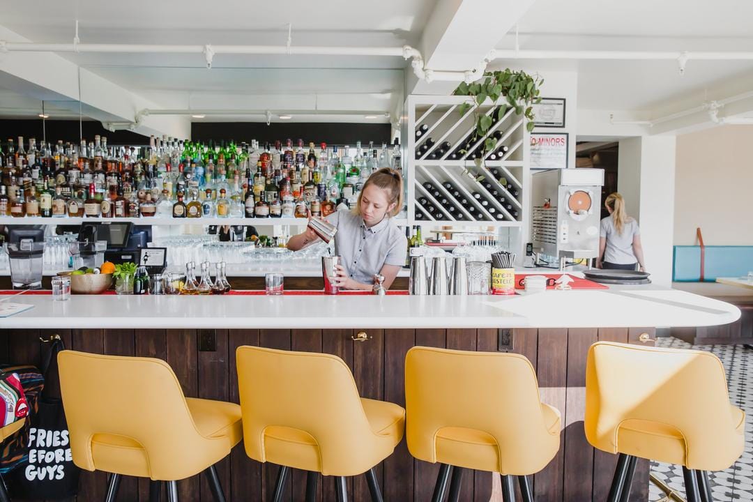 working bar showing yellow bar stool in cutout