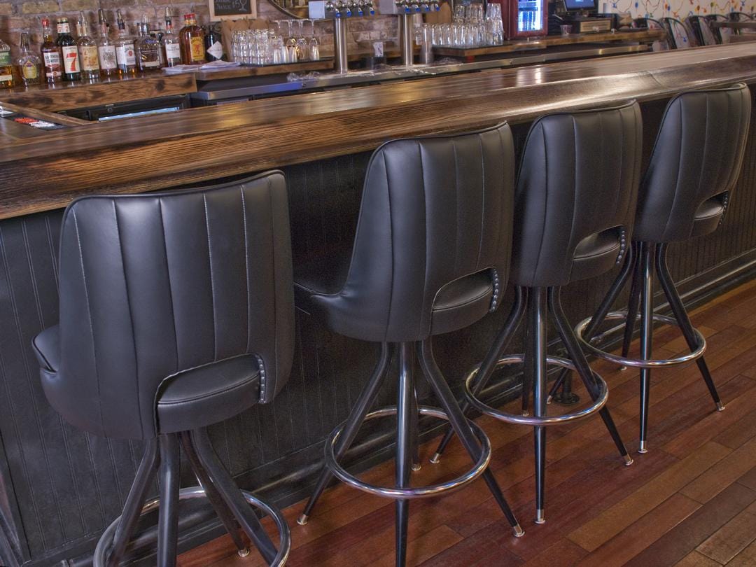 black channeled back bar stool in modern bar