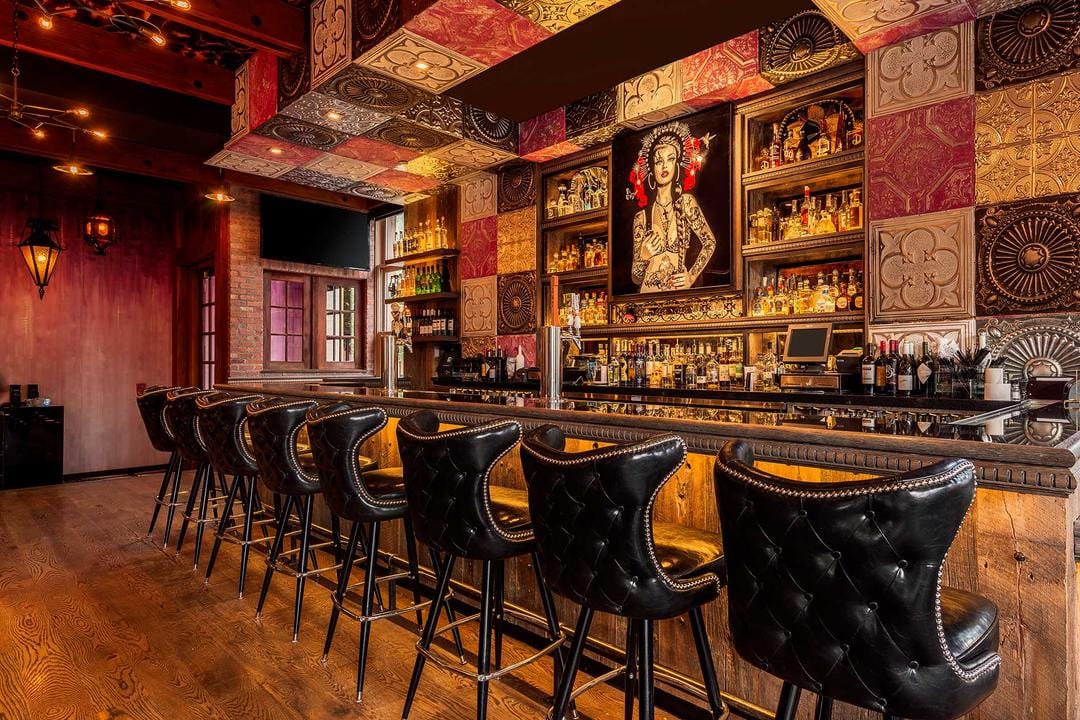 stylish bar with classic tufted button bar stools